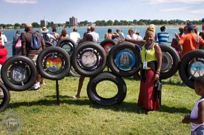 Upcycle Detroit artist and her art inset auto tires