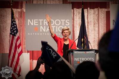 Senator Elizabeth Warren waves at the jubilant crowd