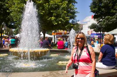 DMM's Michele enjoys the park fountain