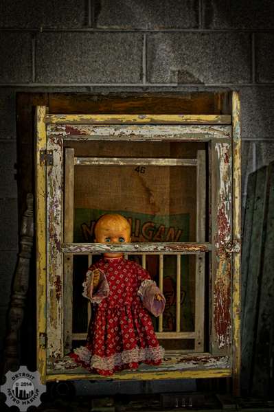This doll was framed!