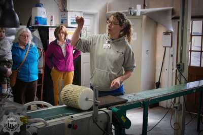 Traci demonstrating the nibbler, which places the seeds