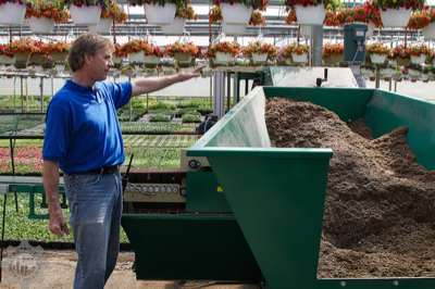 Steve demoing the new equipment that fills the small pots